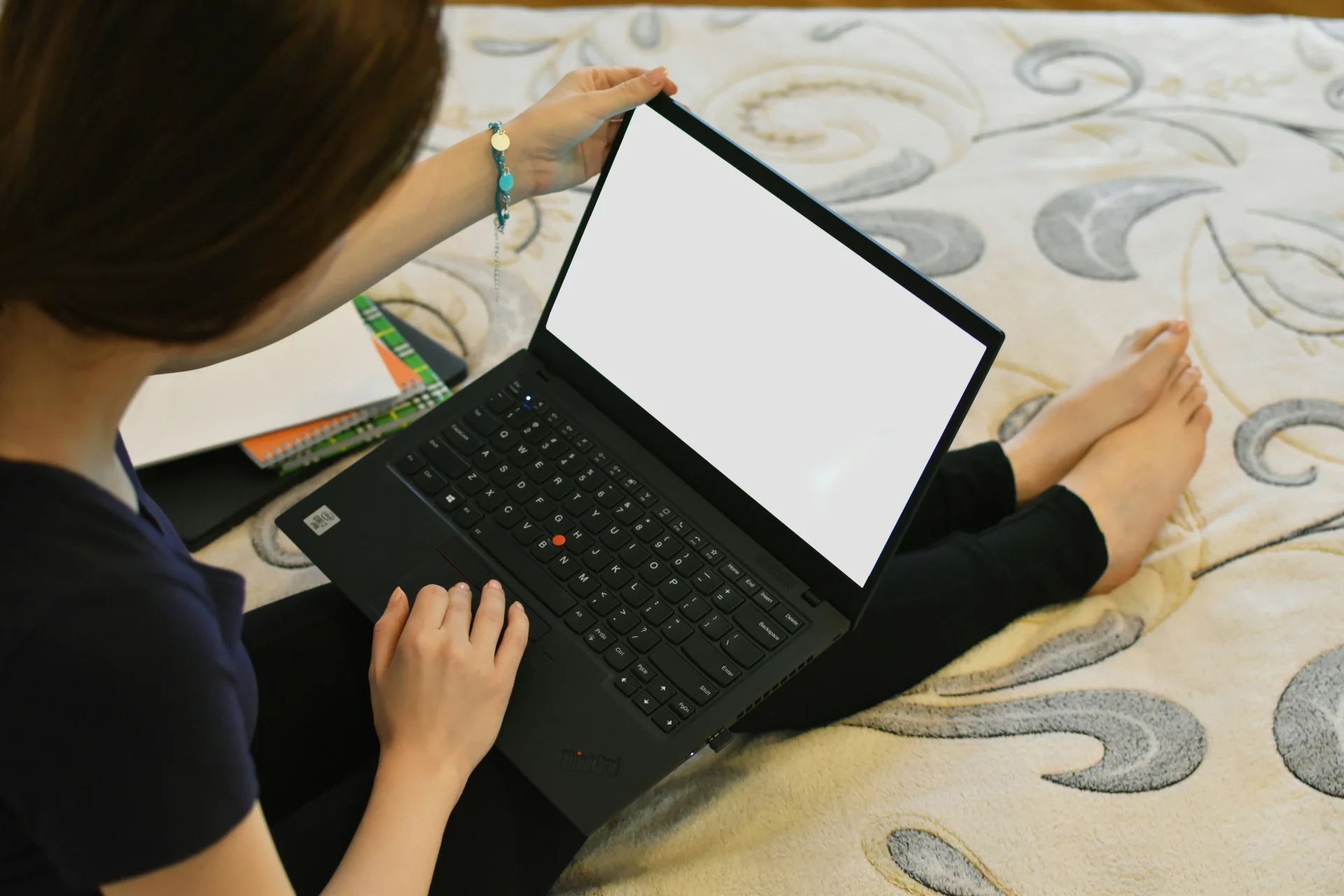 Student working with laptop and notes